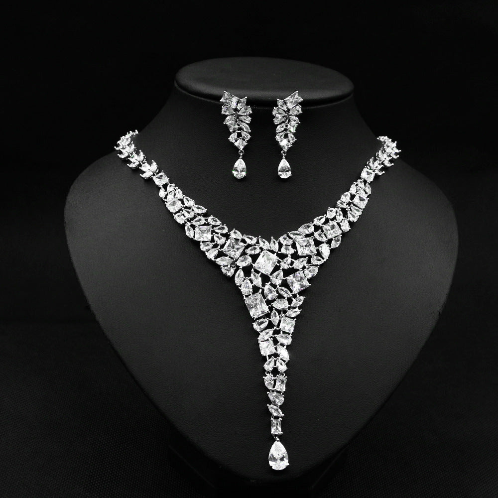 Jewelry set with necklace and earrings on a black background